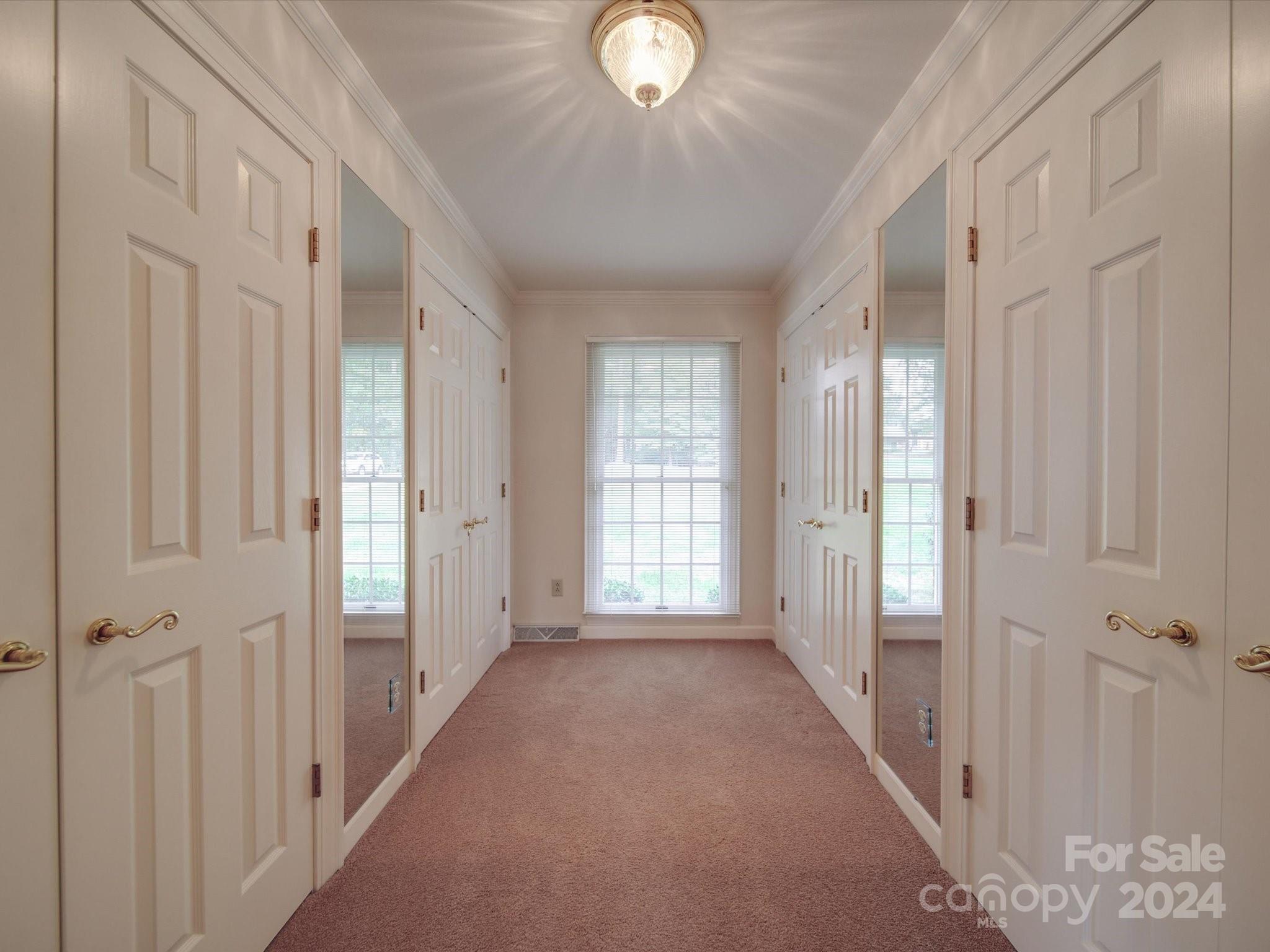 205 James Road Oakboro, NC 28129 - Photo 27 of 48 a view of a hallway with windows