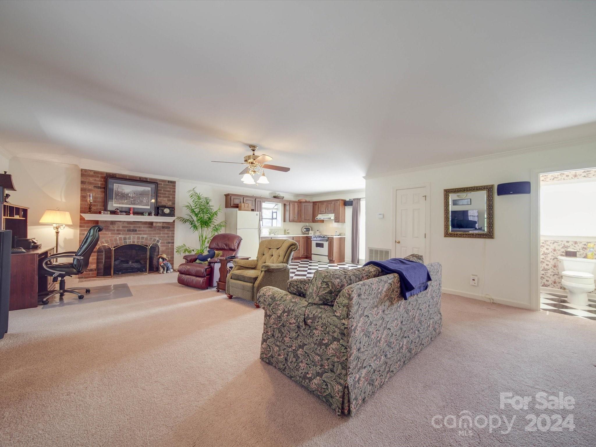 205 James Road Oakboro, NC 28129 - Photo 30 of 48 a living room with furniture and a fireplace
