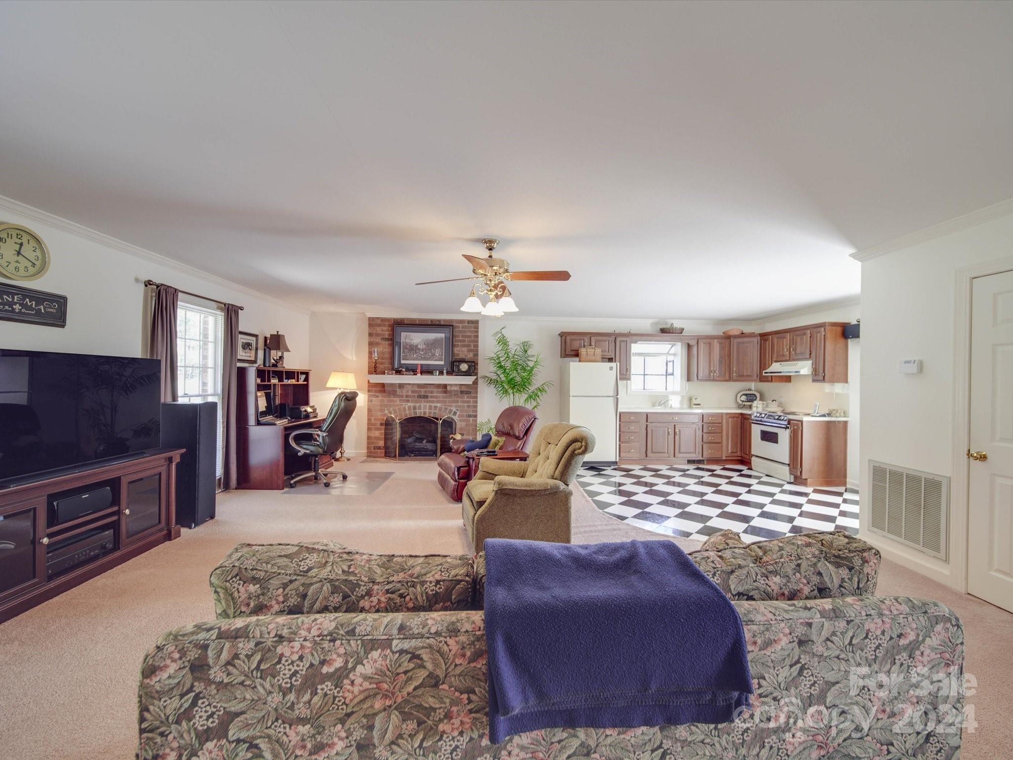 205 James Road Oakboro, NC 28129 - Photo 31 of 48 a living room with furniture or couch and a flat screen tv