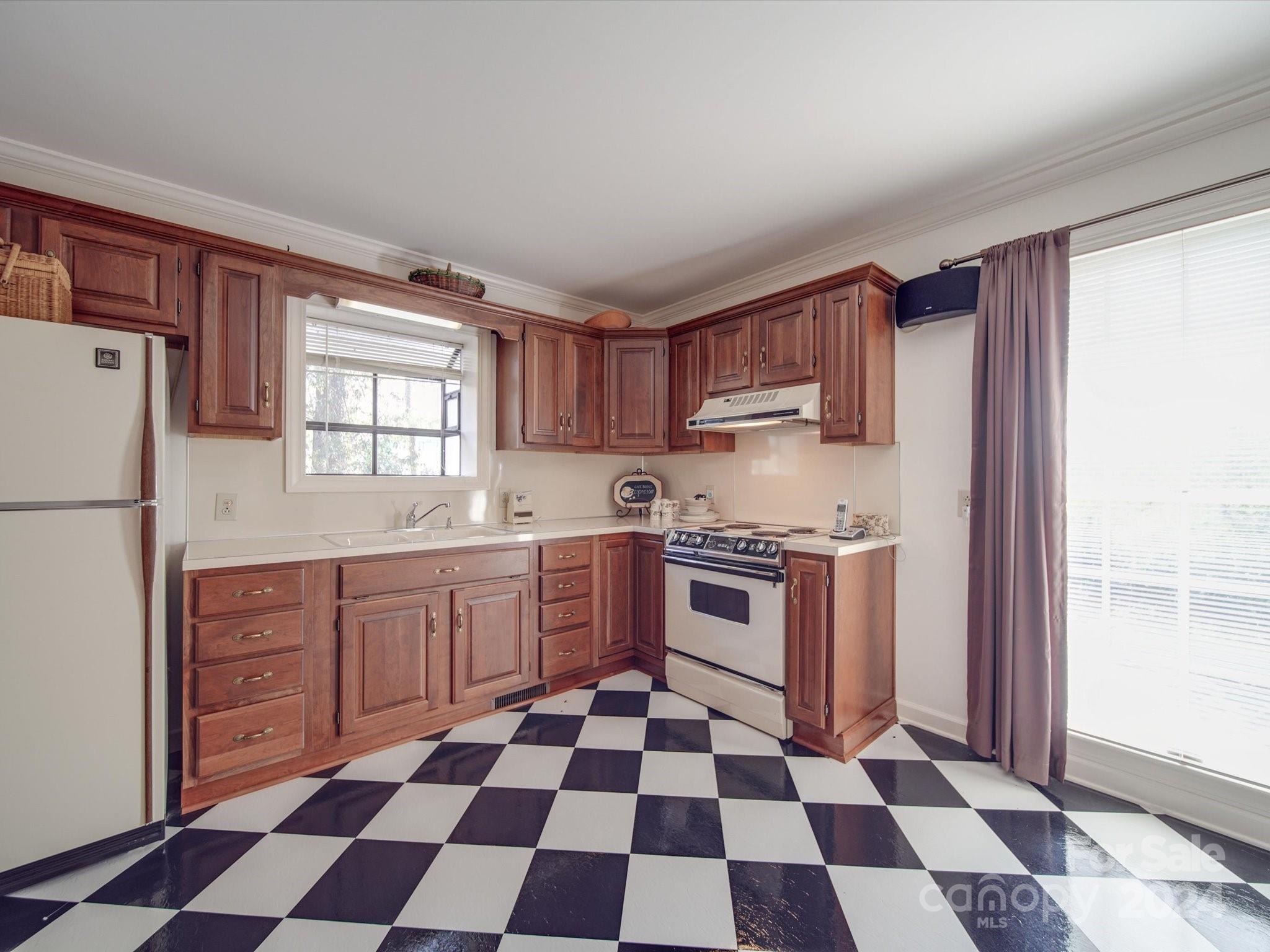 205 James Road Oakboro, NC 28129 - Photo 34 of 48 a kitchen with granite countertop stainless steel appliances a sink and a window