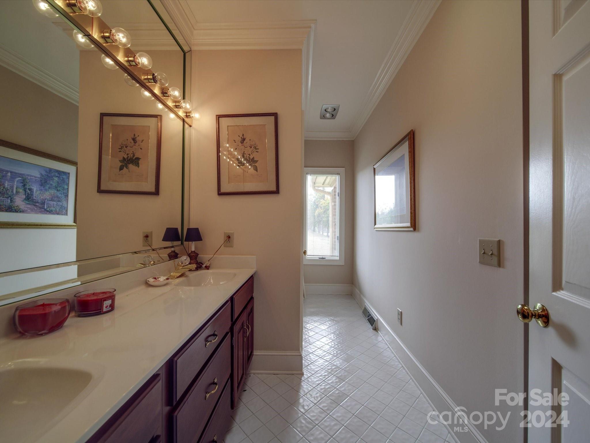 205 James Road Oakboro, NC 28129 - Photo 41 of 48 a bathroom with a sink double vanity granite tub shower and a mirror