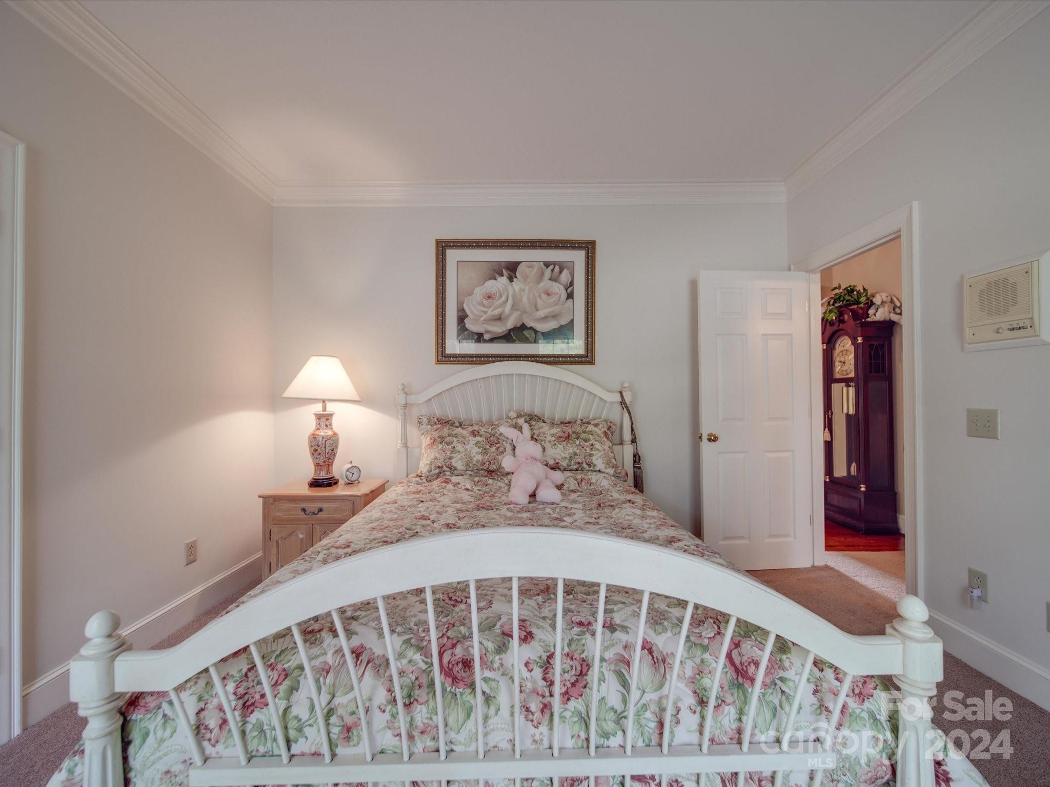 205 James Road Oakboro, NC 28129 - Photo 43 of 48 a bed room with a bed and a painting on the wall