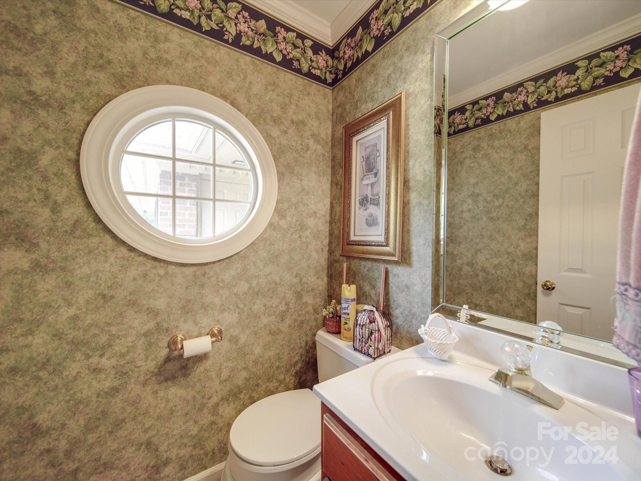 205 James Road Oakboro, NC 28129 - Photo 48 of 48 a bathroom with a sink a mirror a toilet and a mirror