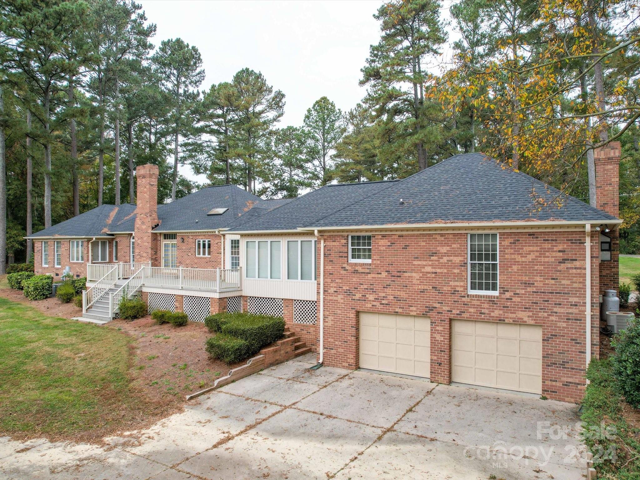 205 James Road Oakboro, NC 28129 - Photo 5 of 48 a front view of a house with a yard and garage