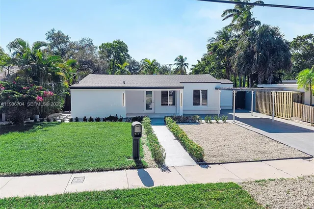 front view of a house with a yard