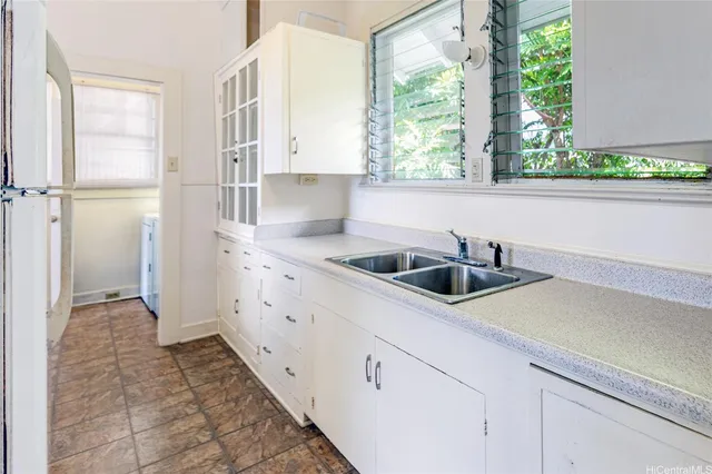 a kitchen with a sink and a window