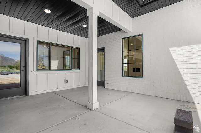 1631 West Century Lane, Unit C Mapleton, UT 84664 - Photo 22 of 31 Covered patio featuring concrete flooring and a white board-and-batten exterior