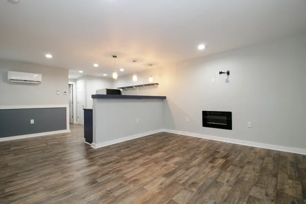 a view of a kitchen with a sink and a refrigerator