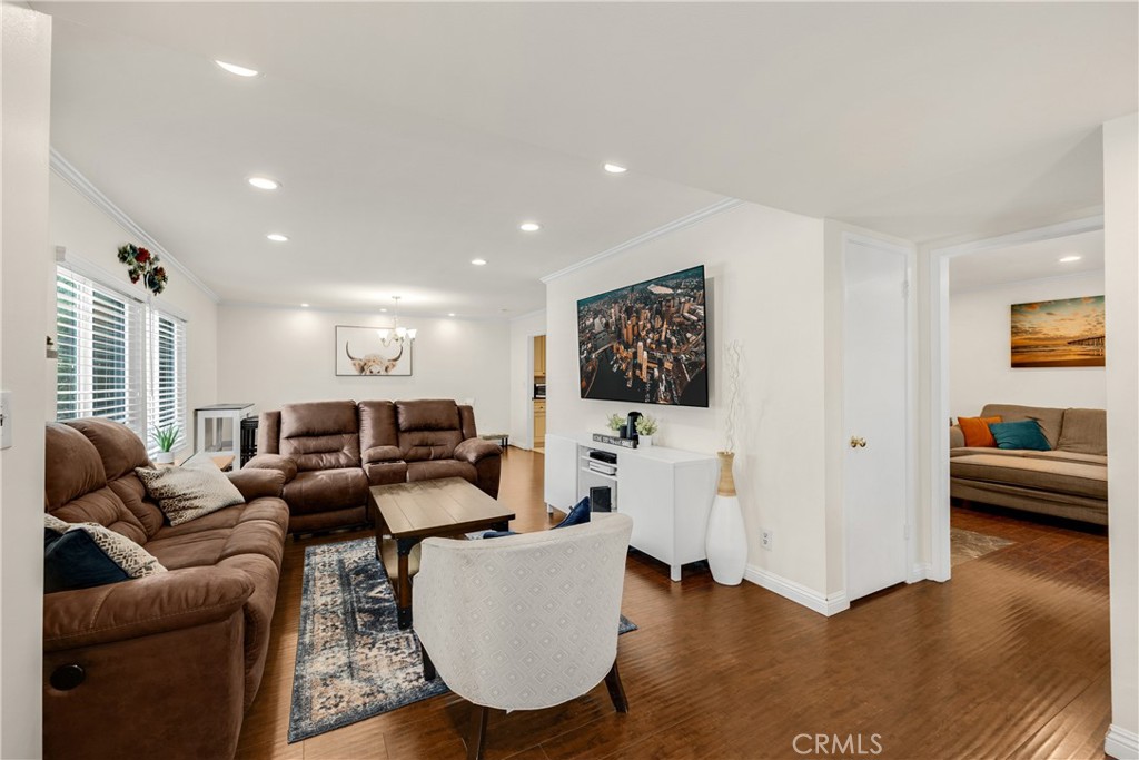9267 Walker Street Cypress, CA 90630 - Photo 1 of 1 a living room with furniture and a wooden floor
