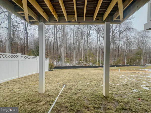 a view of a backyard of the house