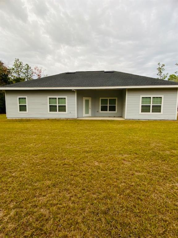 9050 Northeast 80th Street Bronson, FL 32621 - Photo 12 of 12 a view of house with ocean view