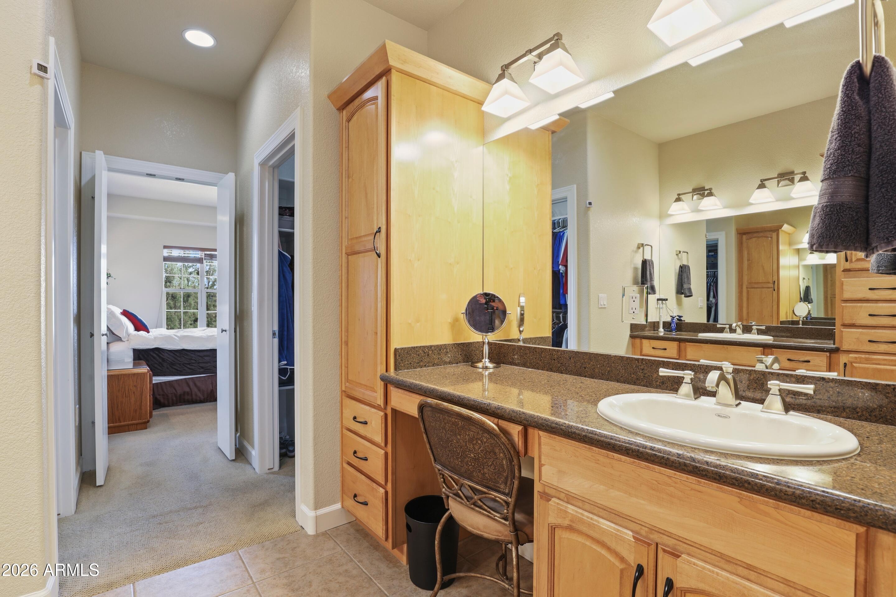 509 Saguaro Circle Payson, AZ 85541 - Photo 46 of 73 a en suite bathroom with a sink double vanity and a mirror