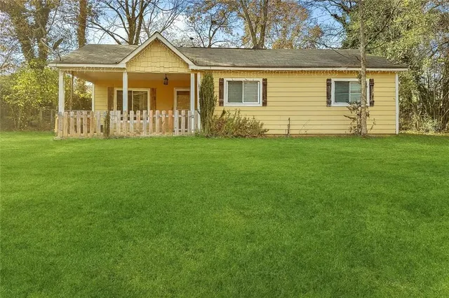 a view of a house with a yard