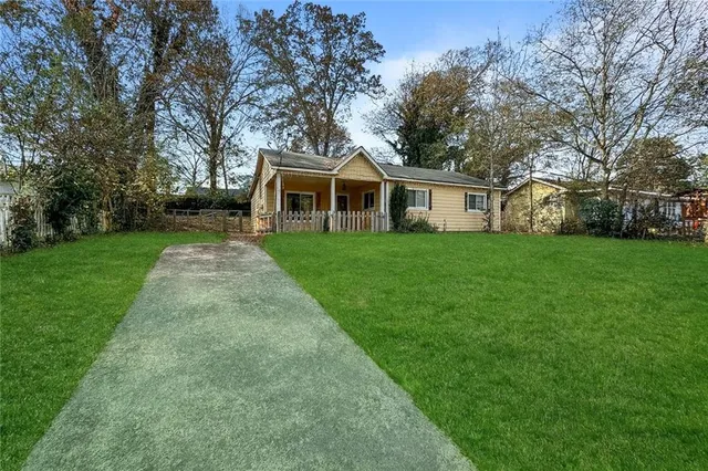 front view of a house with a yard