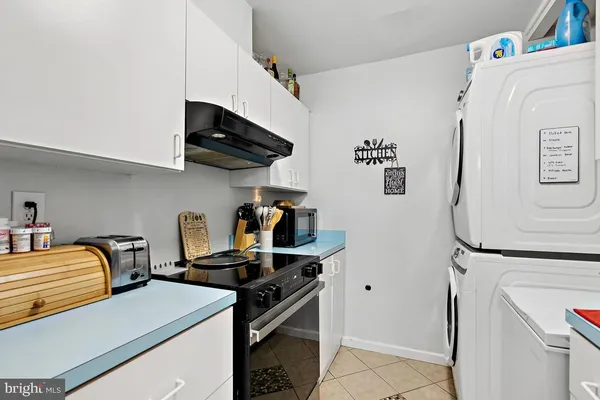 a kitchen with stainless steel appliances a sink and a stove