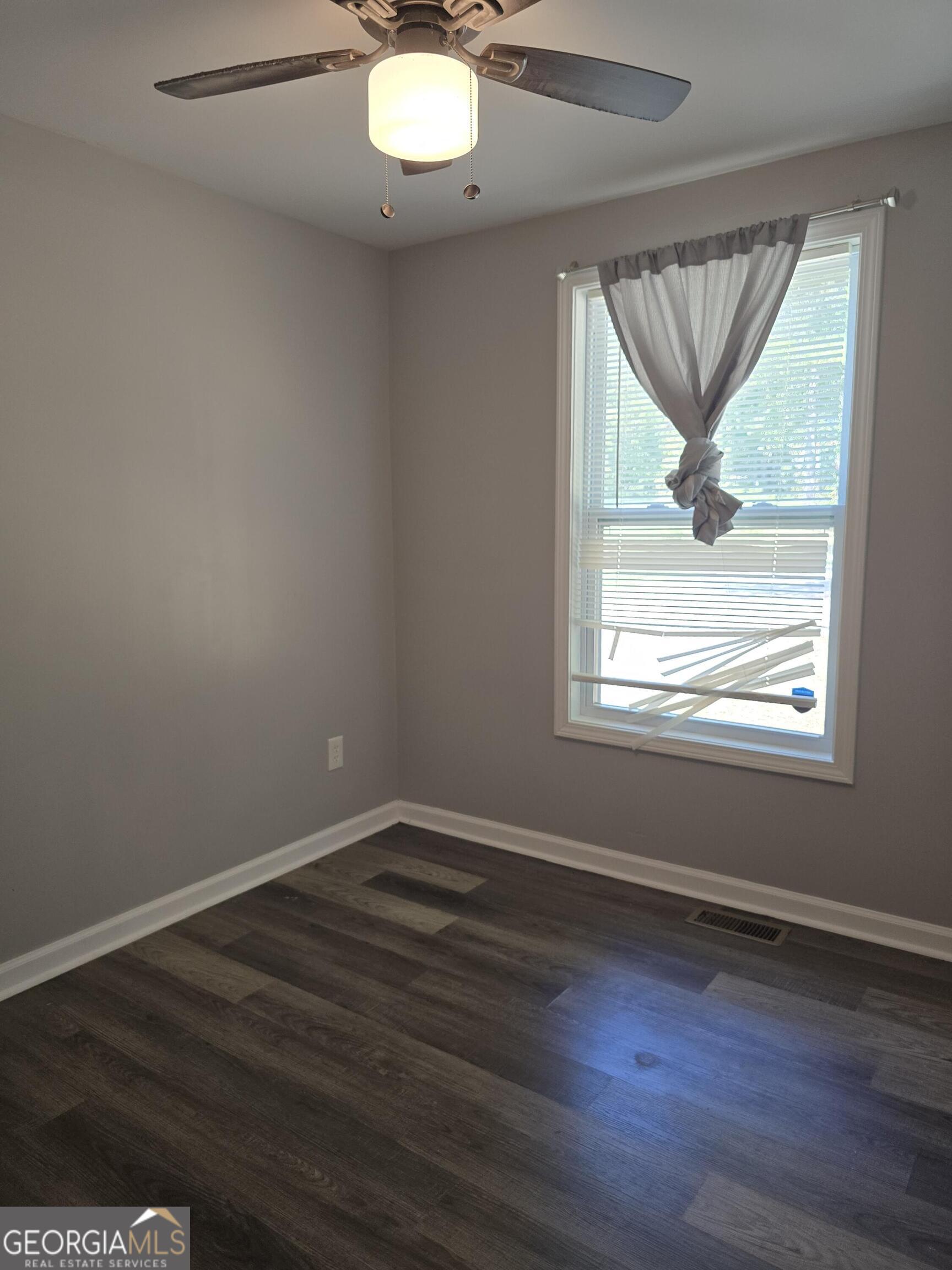 1109 Liberty Church Road Bremen, GA 30110 - Photo 15 of 26 an empty room with wooden floor and windows