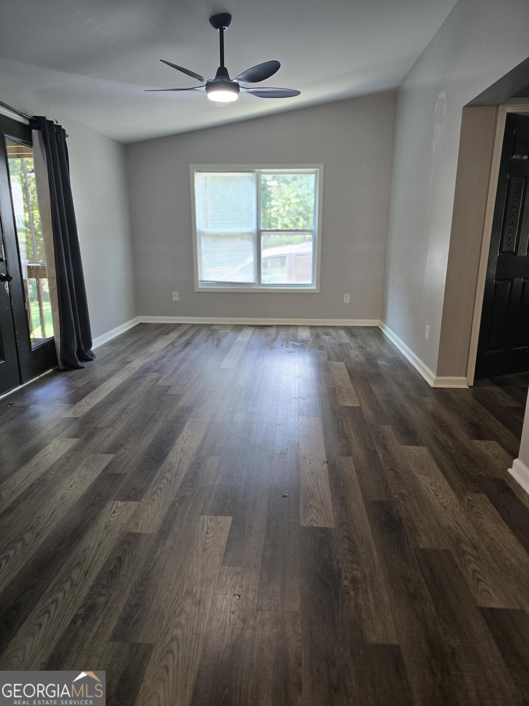 1109 Liberty Church Road Bremen, GA 30110 - Photo 16 of 26 an empty room with wooden floor and windows