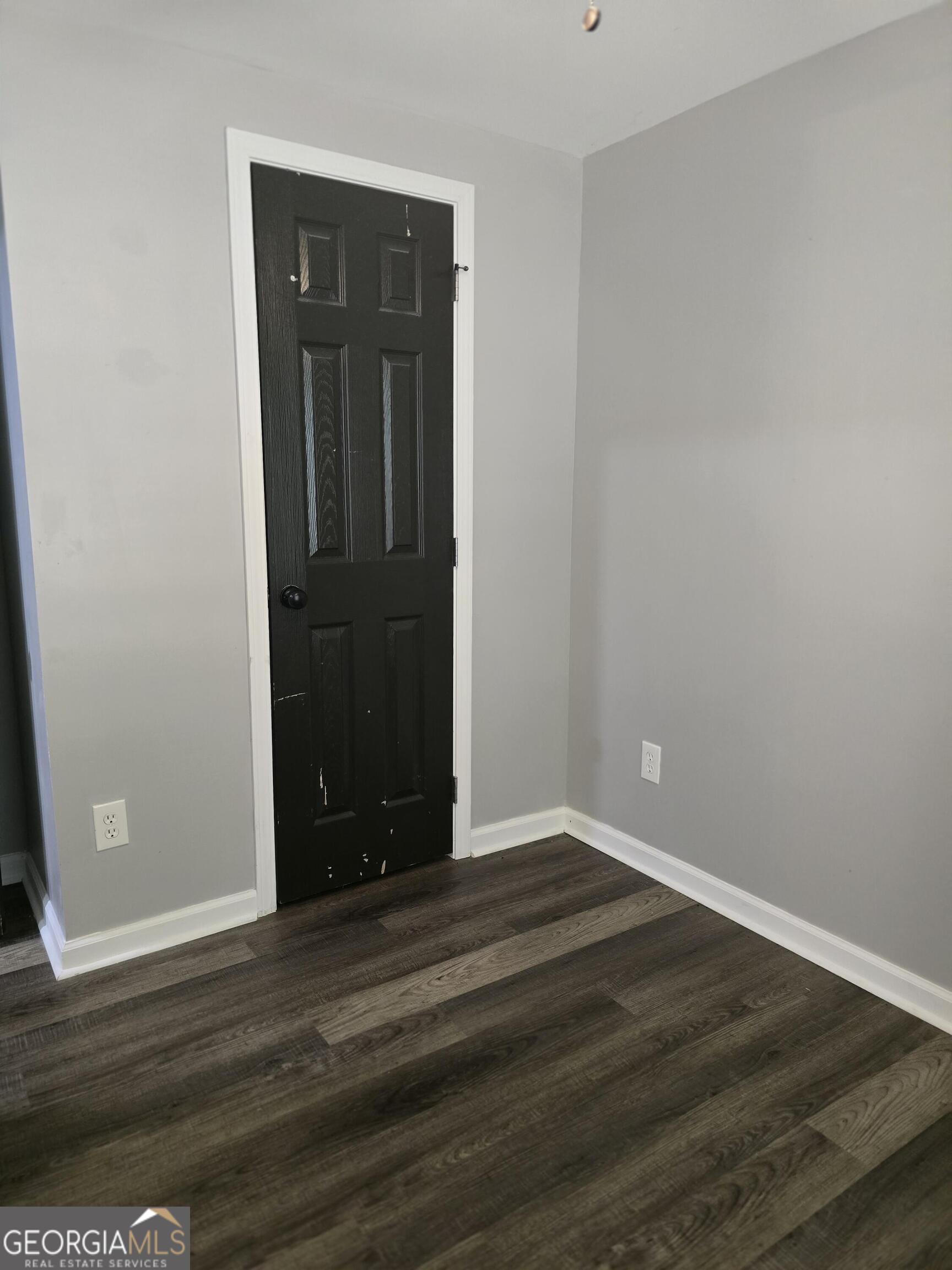 1109 Liberty Church Road Bremen, GA 30110 - Photo 18 of 26 a view of an empty room with wooden floor and closet