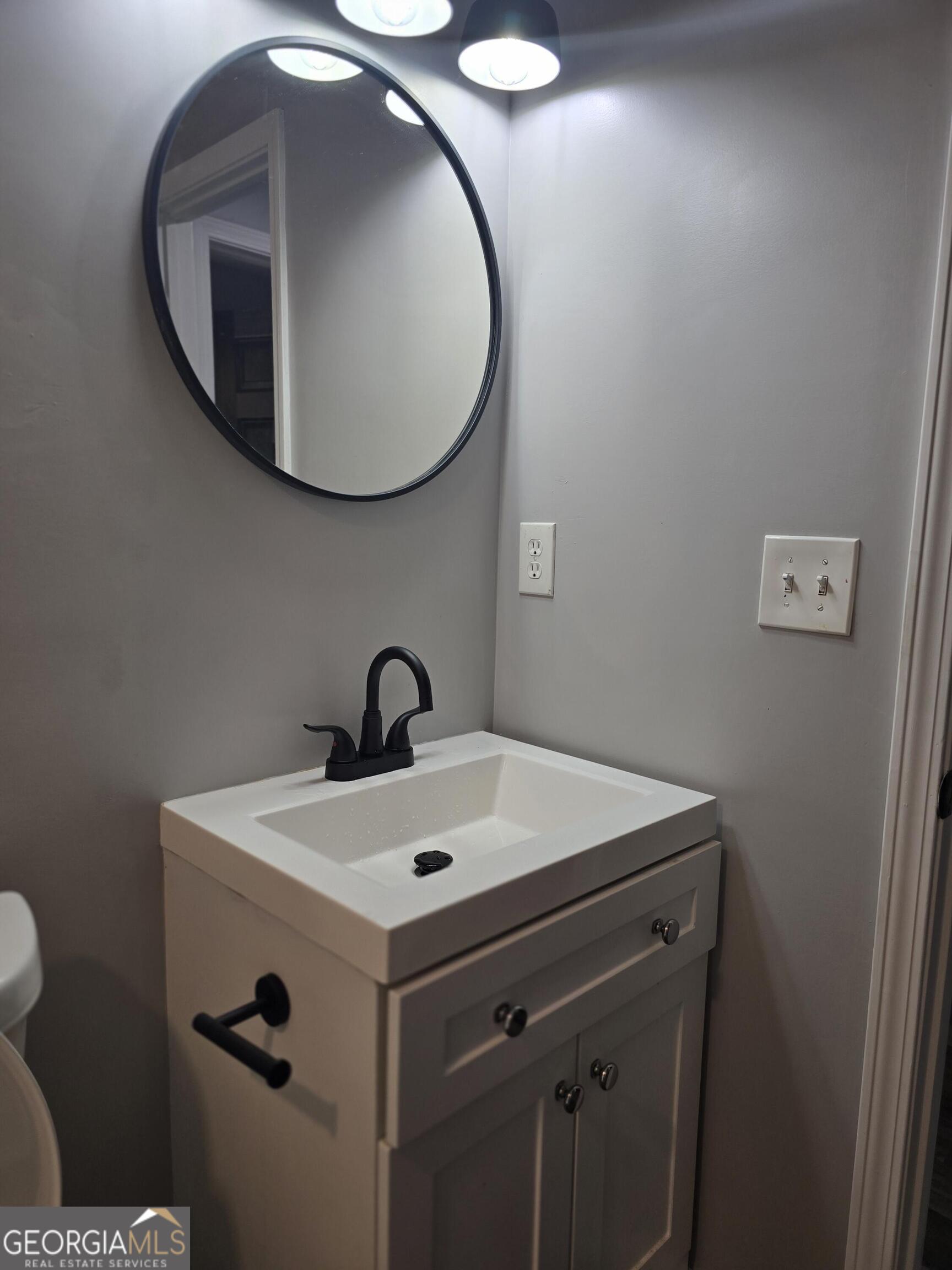 1109 Liberty Church Road Bremen, GA 30110 - Photo 20 of 26 a bathroom with a sink and a mirror