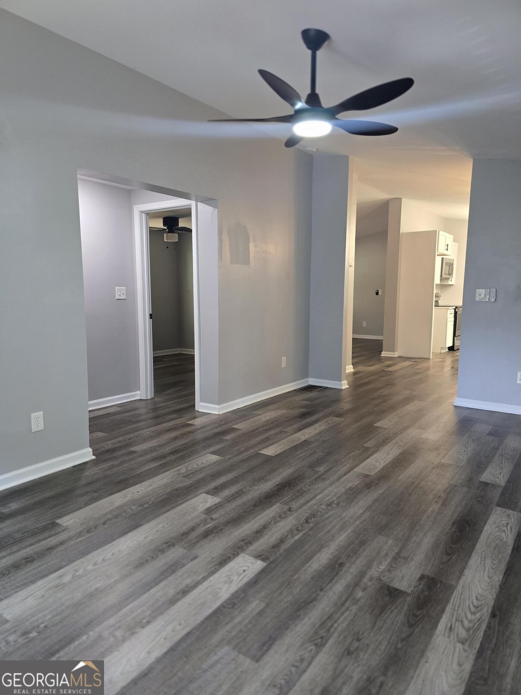 1109 Liberty Church Road Bremen, GA 30110 - Photo 23 of 26 wooden floor in an empty room with a ceiling fan