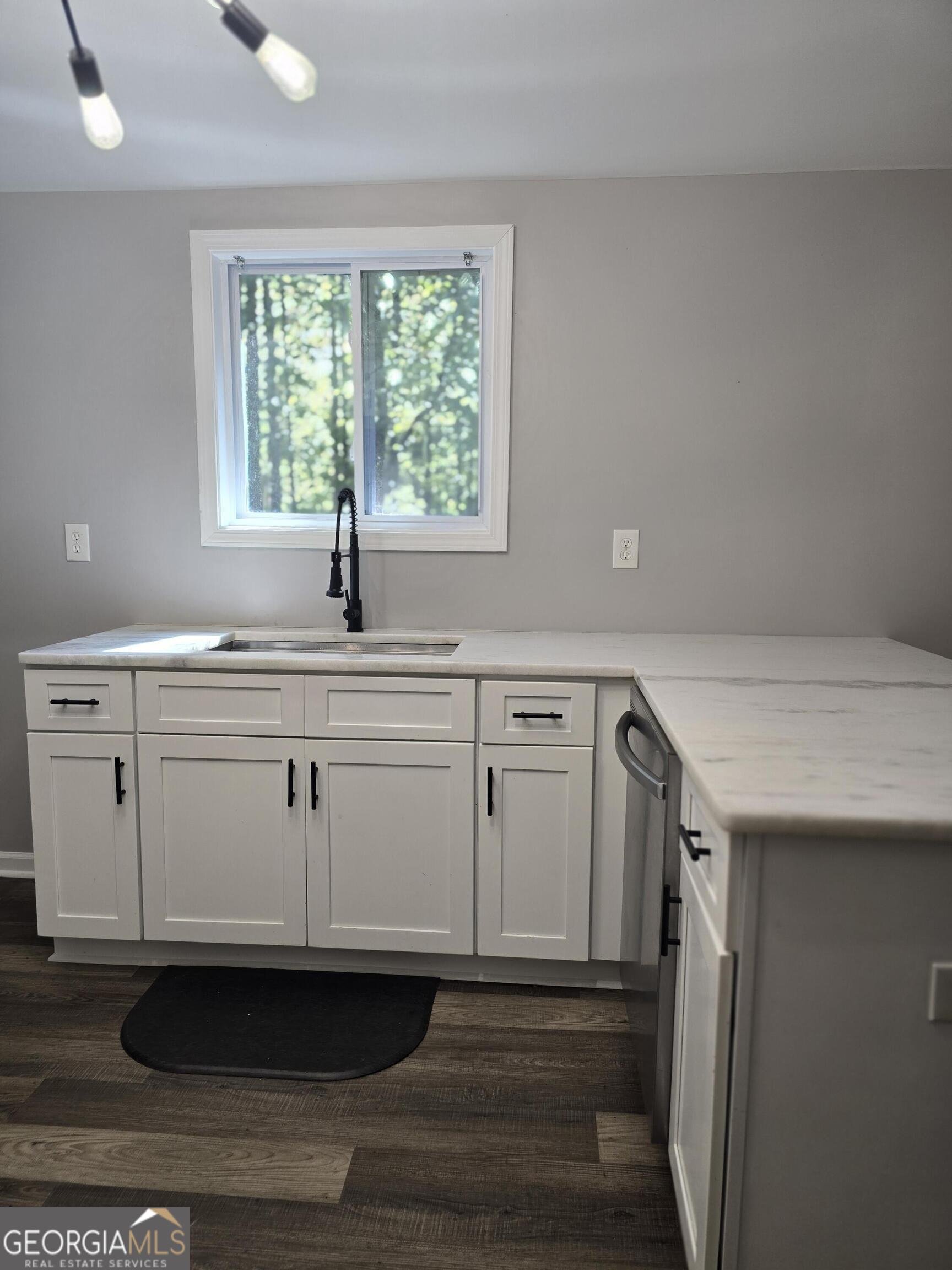 1109 Liberty Church Road Bremen, GA 30110 - Photo 26 of 26 a kitchen with a sink and cabinets