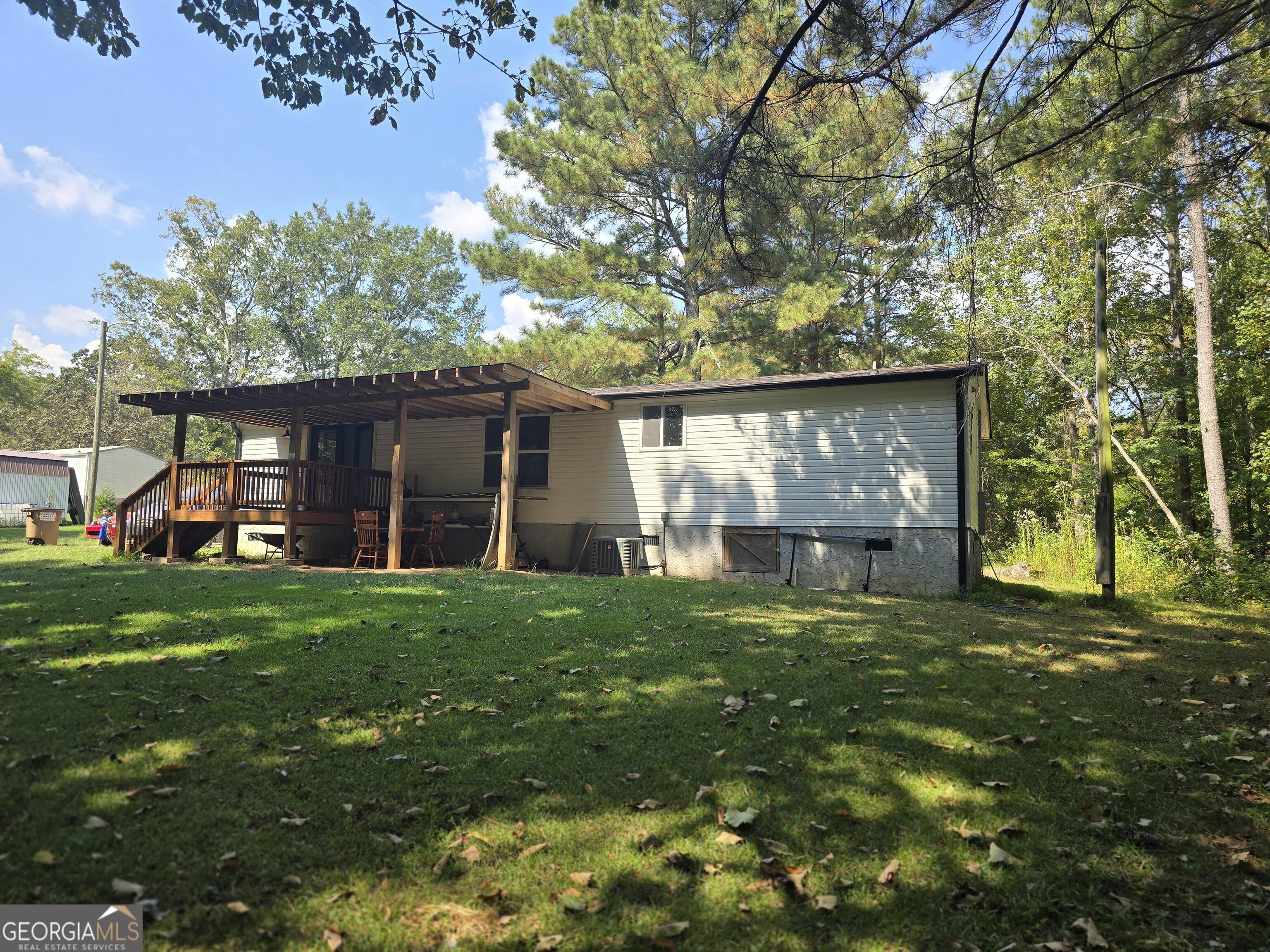 1109 Liberty Church Road Bremen, GA 30110 - Photo 4 of 26 a view of a house with a yard and garden