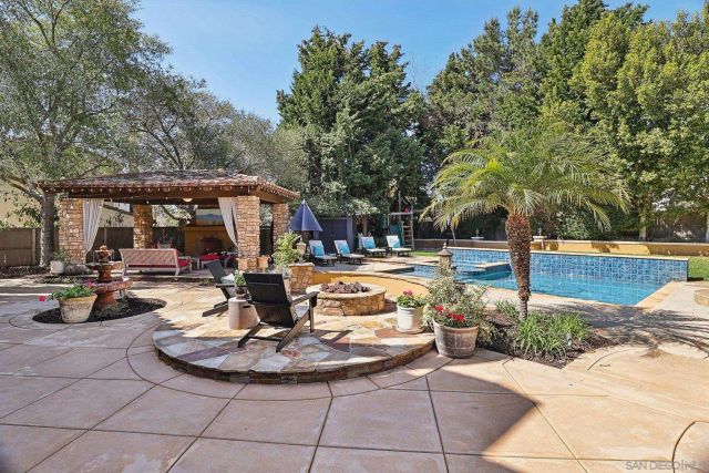 a spacious bedroom with a bed and glass window