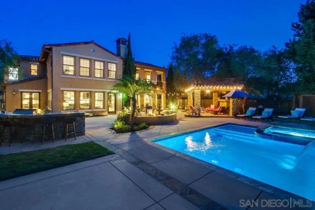 a bathroom with a sink vanity tub and a mirror