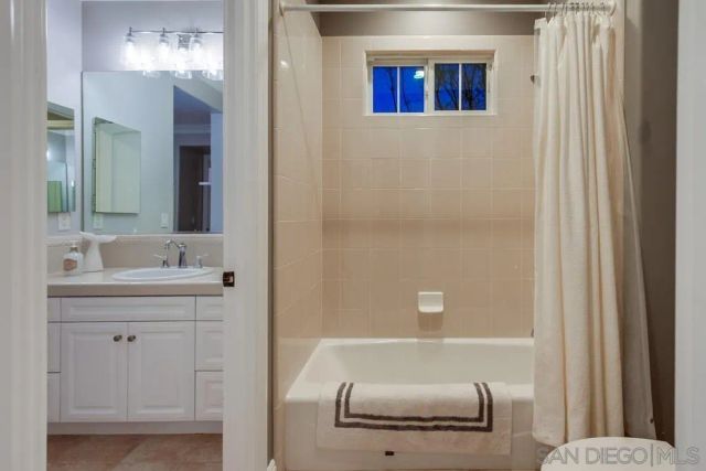 a livingroom with workspace and a couch