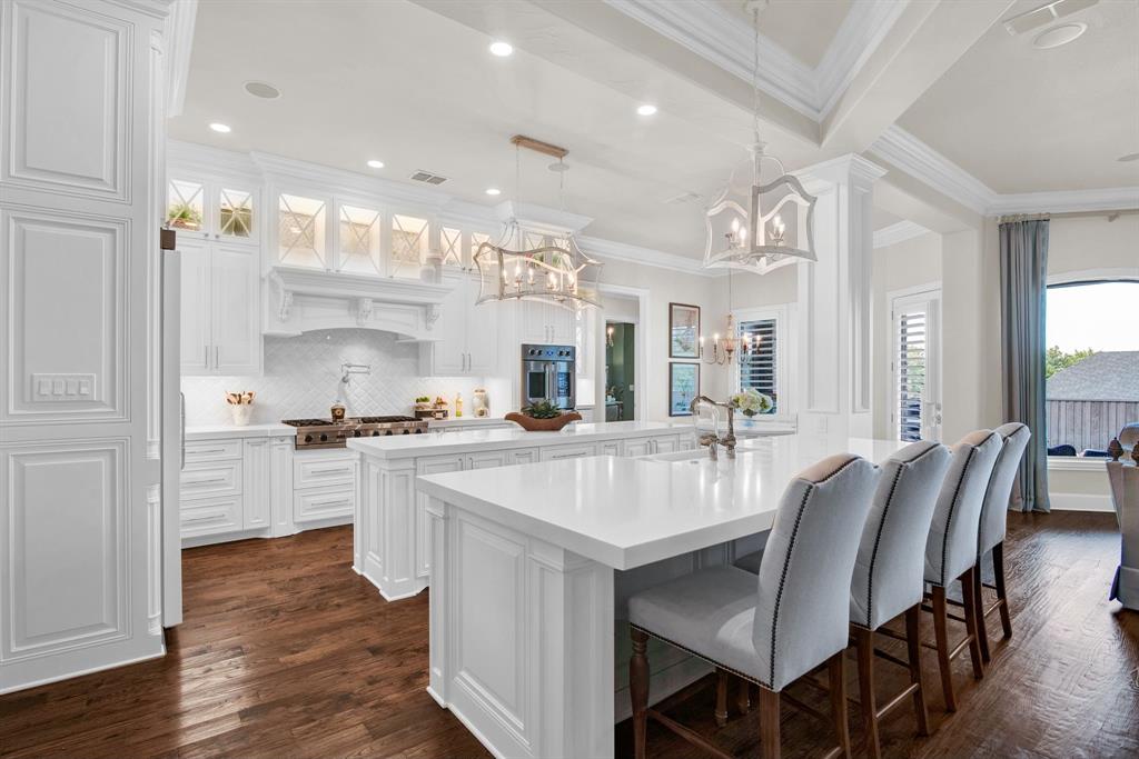 2921 Sedalia Trail Sherman, TX 75092 - Photo 11 of 40 a large kitchen with kitchen island a island a sink a stove and a center island