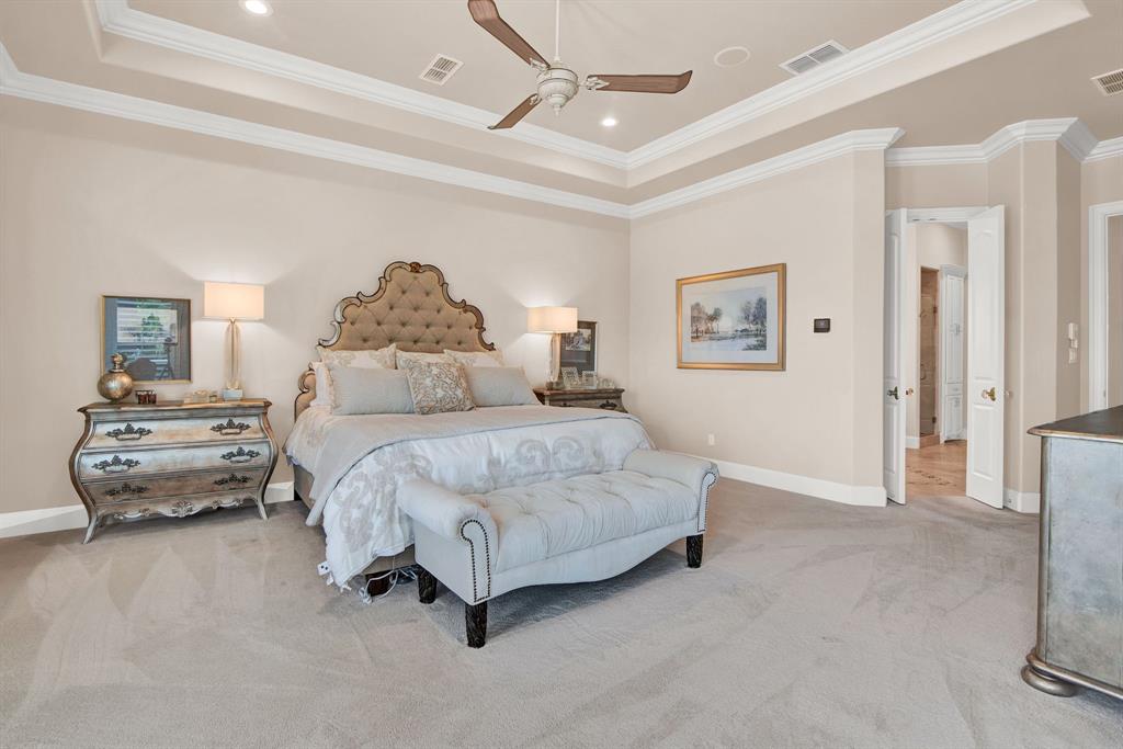 2921 Sedalia Trail Sherman, TX 75092 - Photo 25 of 40 a spacious bedroom with a bed and a chandelier