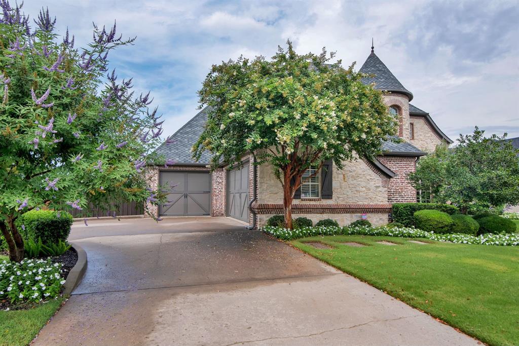 2921 Sedalia Trail Sherman, TX 75092 - Photo 4 of 40 a front view of a house with a yard and garage