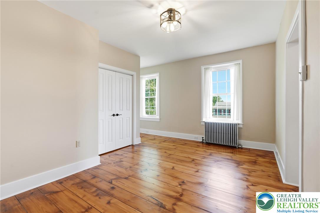 4682 Steuben Road Bethlehem, PA 18020 - Photo 31 of 79 Warm hardwood floors and abundant natural light define this cozy bedroom retreat.