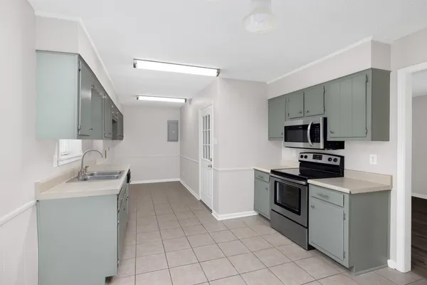 an empty room with ceiling fan