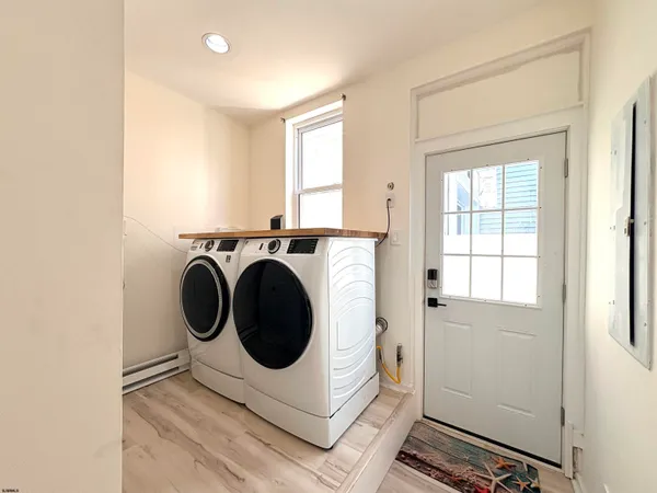 a utility room with dryer and washer