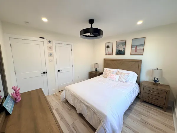a bedroom with a bed and a chandelier
