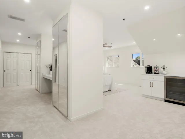 a view of a kitchen with a sink and cabinets