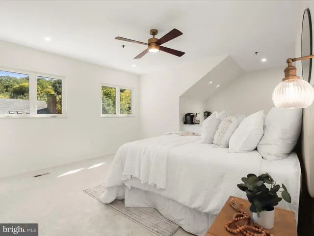 a bedroom with a bed and window