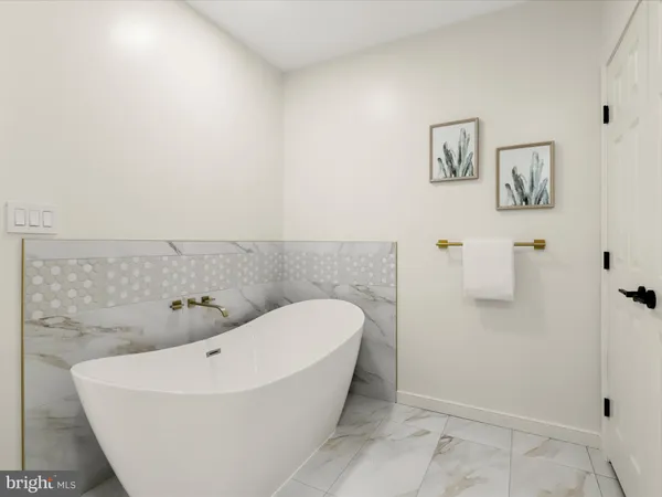 a bathroom with a bathtub and shower