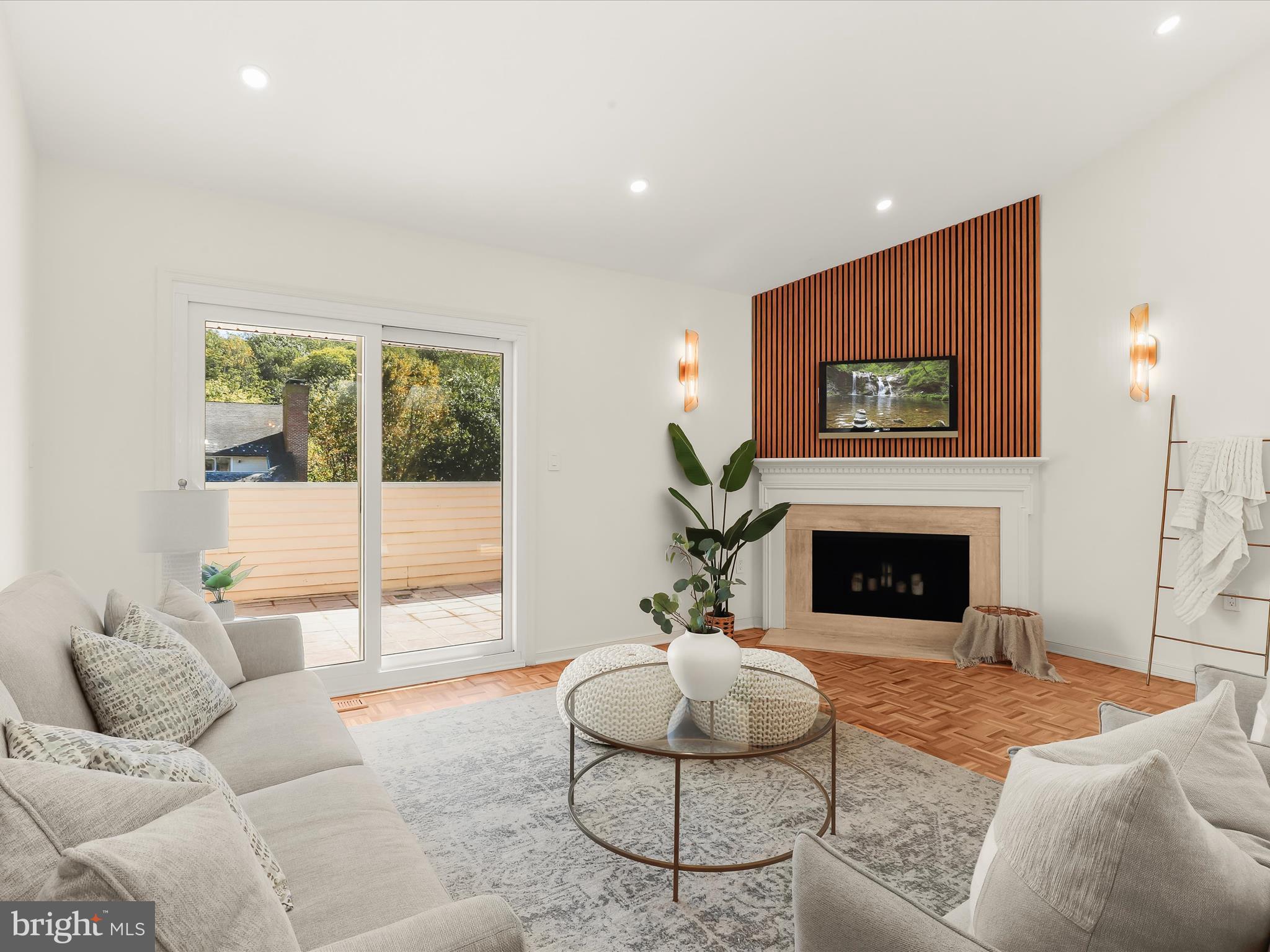 2331 Old Court Road, Unit 506 Pikesville, MD 21208 - Photo 4 of 51 a living room with furniture and a fireplace
