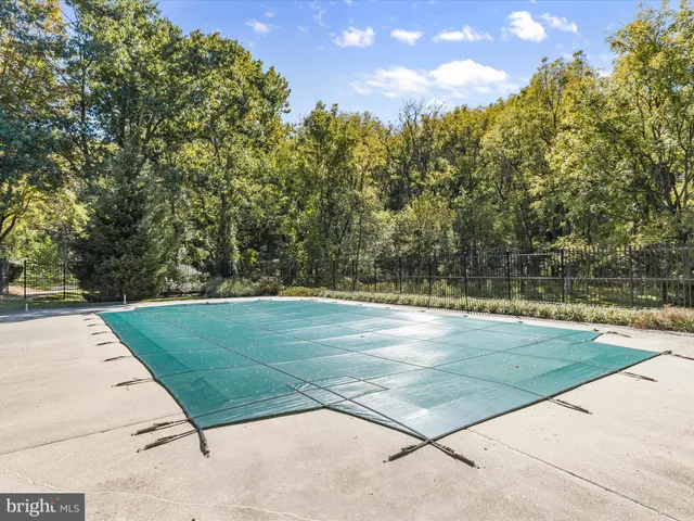 a view of a house with a yard and a garden