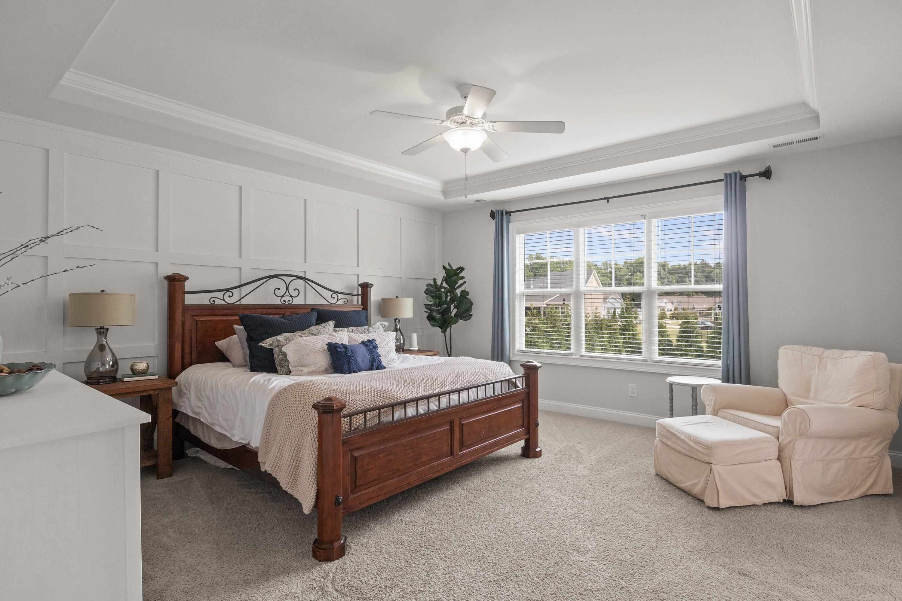4136 Olde Judd Drive Willow Spring, NC 27592 - Photo 17 of 47 a bedroom with a bed and a large window