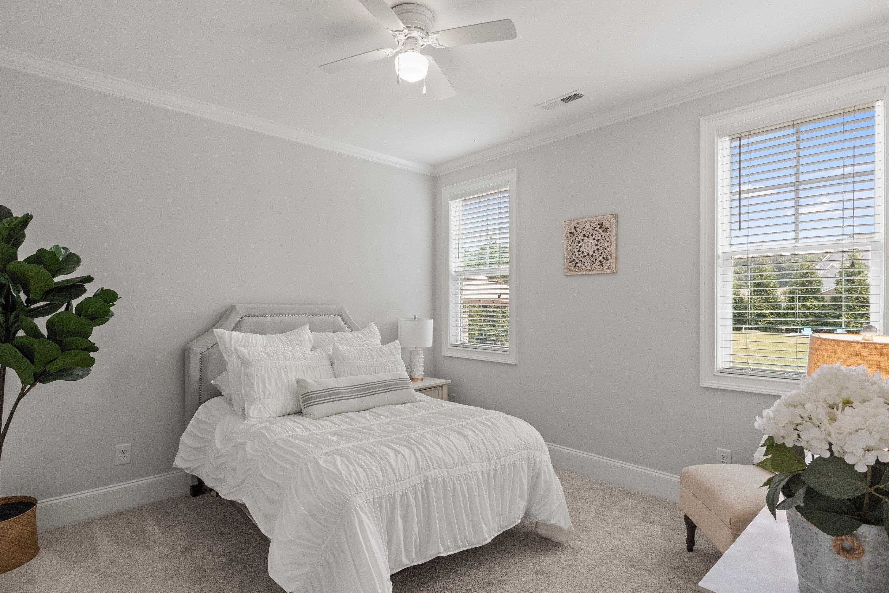 4136 Olde Judd Drive Willow Spring, NC 27592 - Photo 23 of 47 a bedroom with a bed and a window