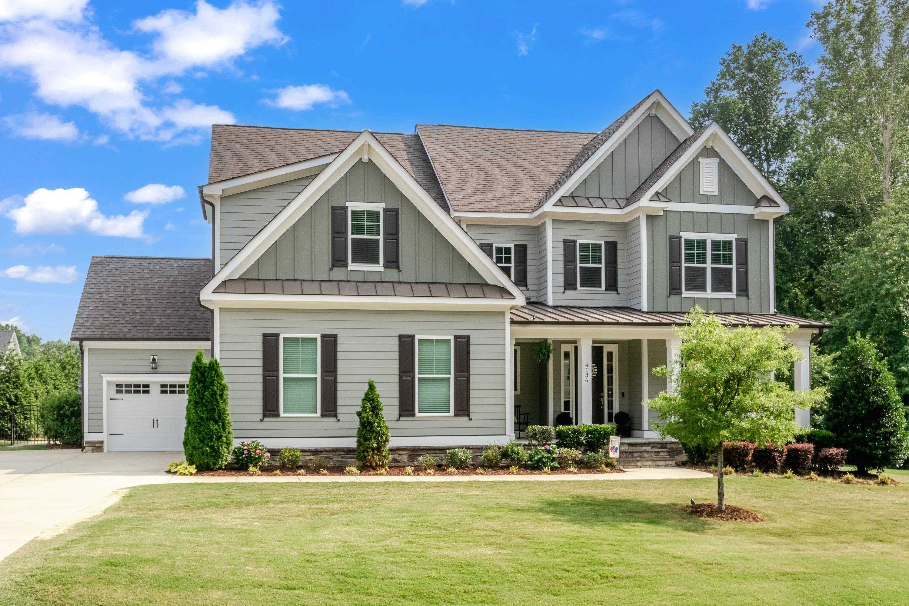 4136 Olde Judd Drive Willow Spring, NC 27592 - Photo 3 of 47 a front view of a house with a yard