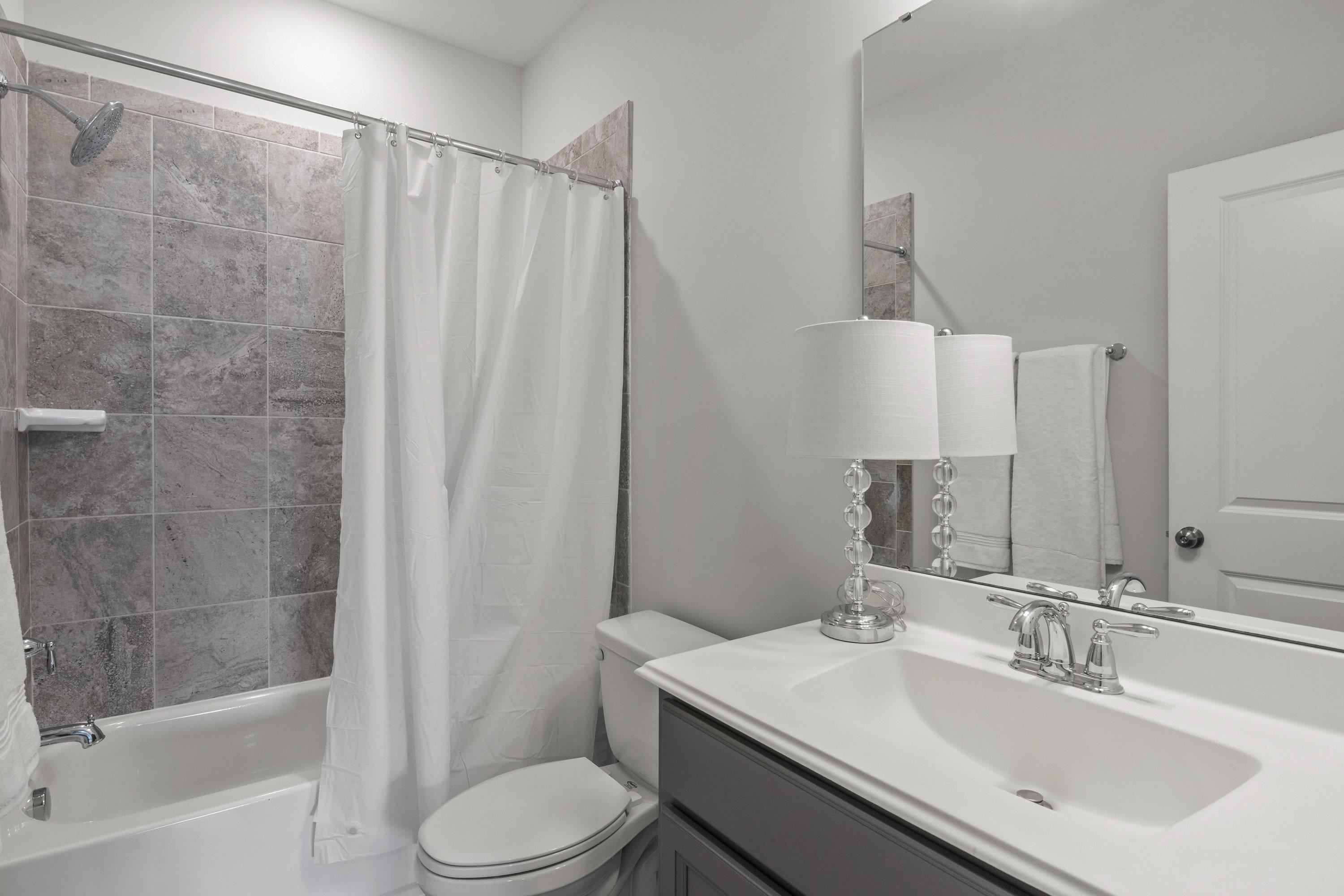 4136 Olde Judd Drive Willow Spring, NC 27592 - Photo 32 of 47 a bathroom with a sink toilet and shower