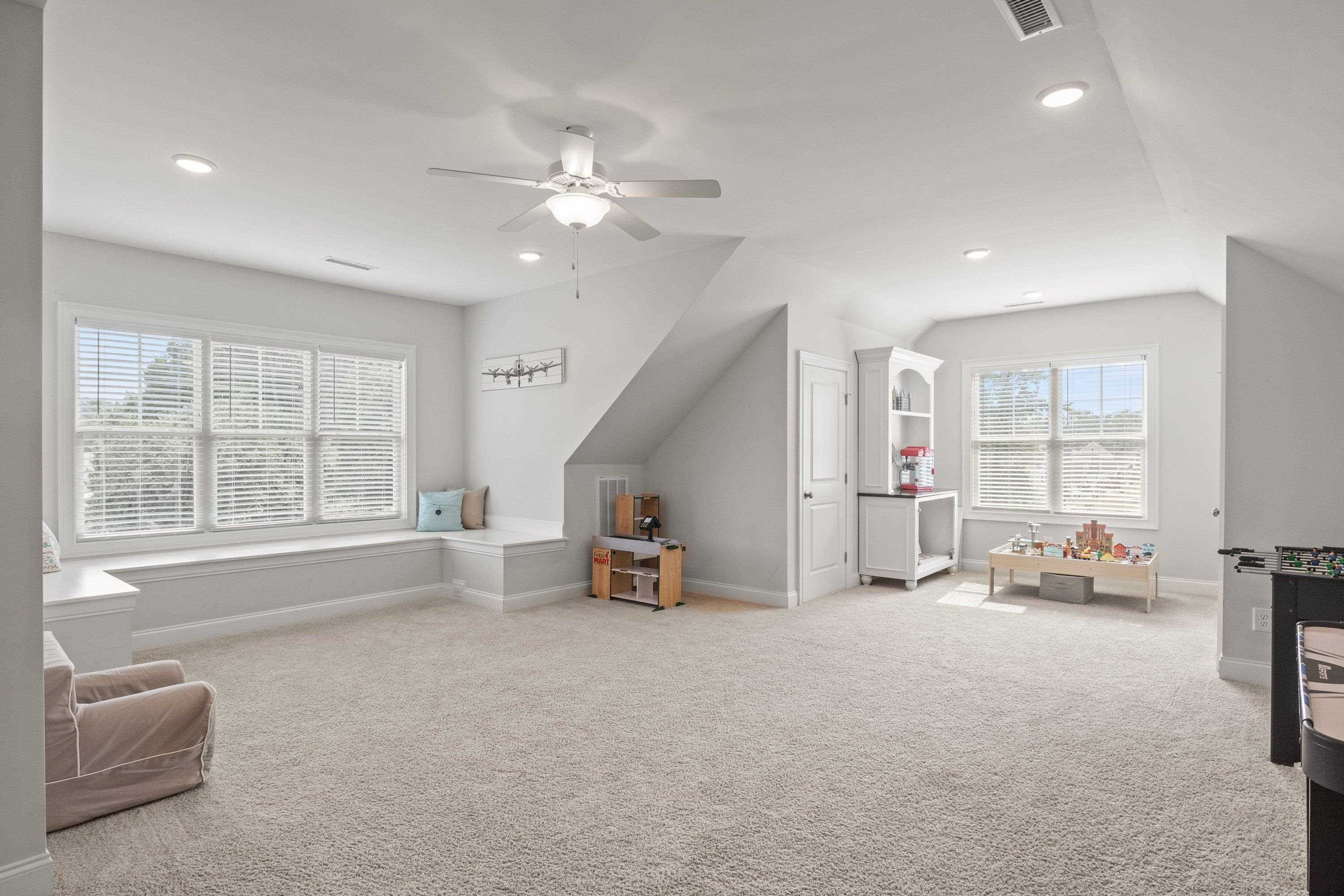 4136 Olde Judd Drive Willow Spring, NC 27592 - Photo 33 of 47 a living room with furniture and a large window