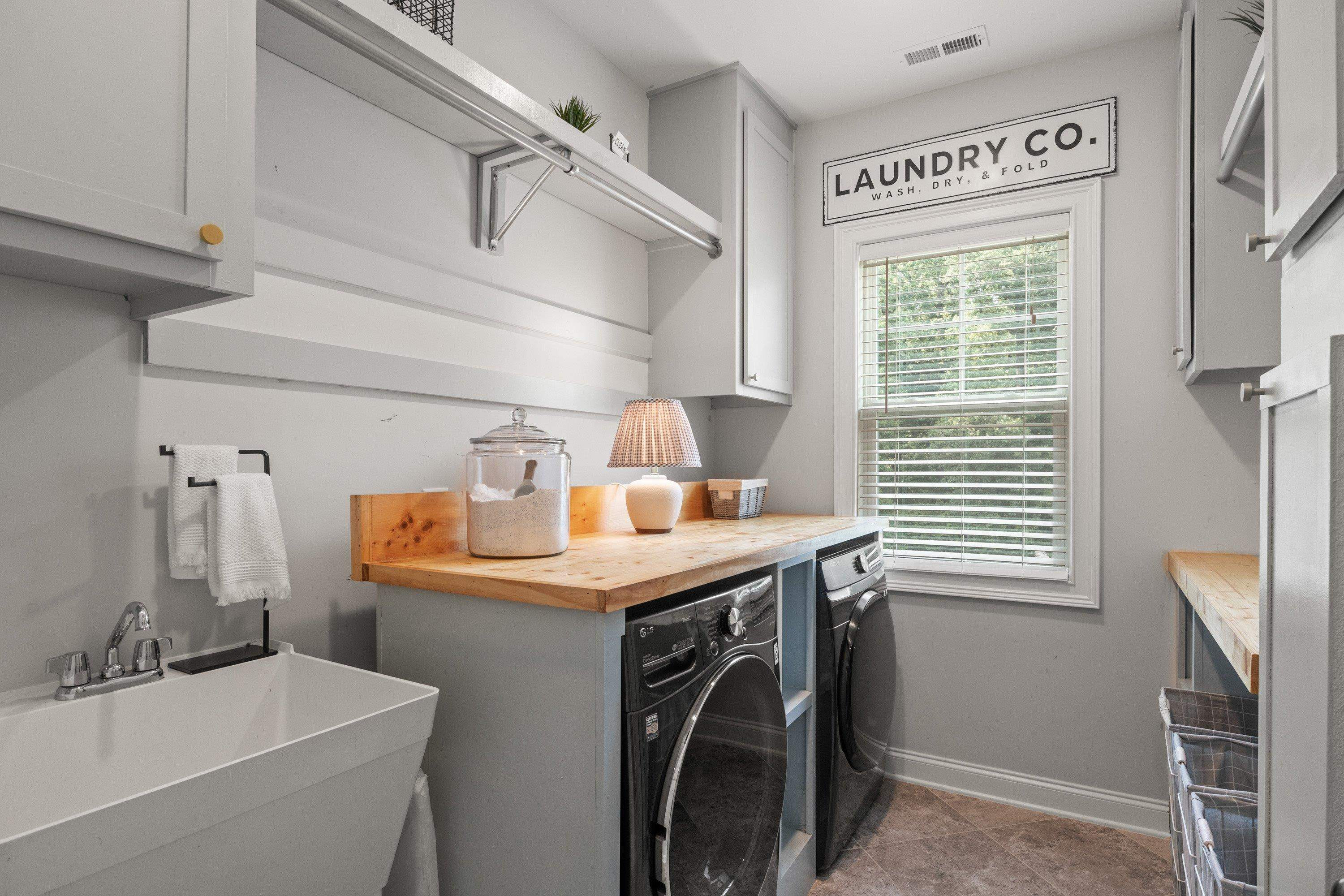 4136 Olde Judd Drive Willow Spring, NC 27592 - Photo 35 of 47 a utility room with a sink dryer and washer