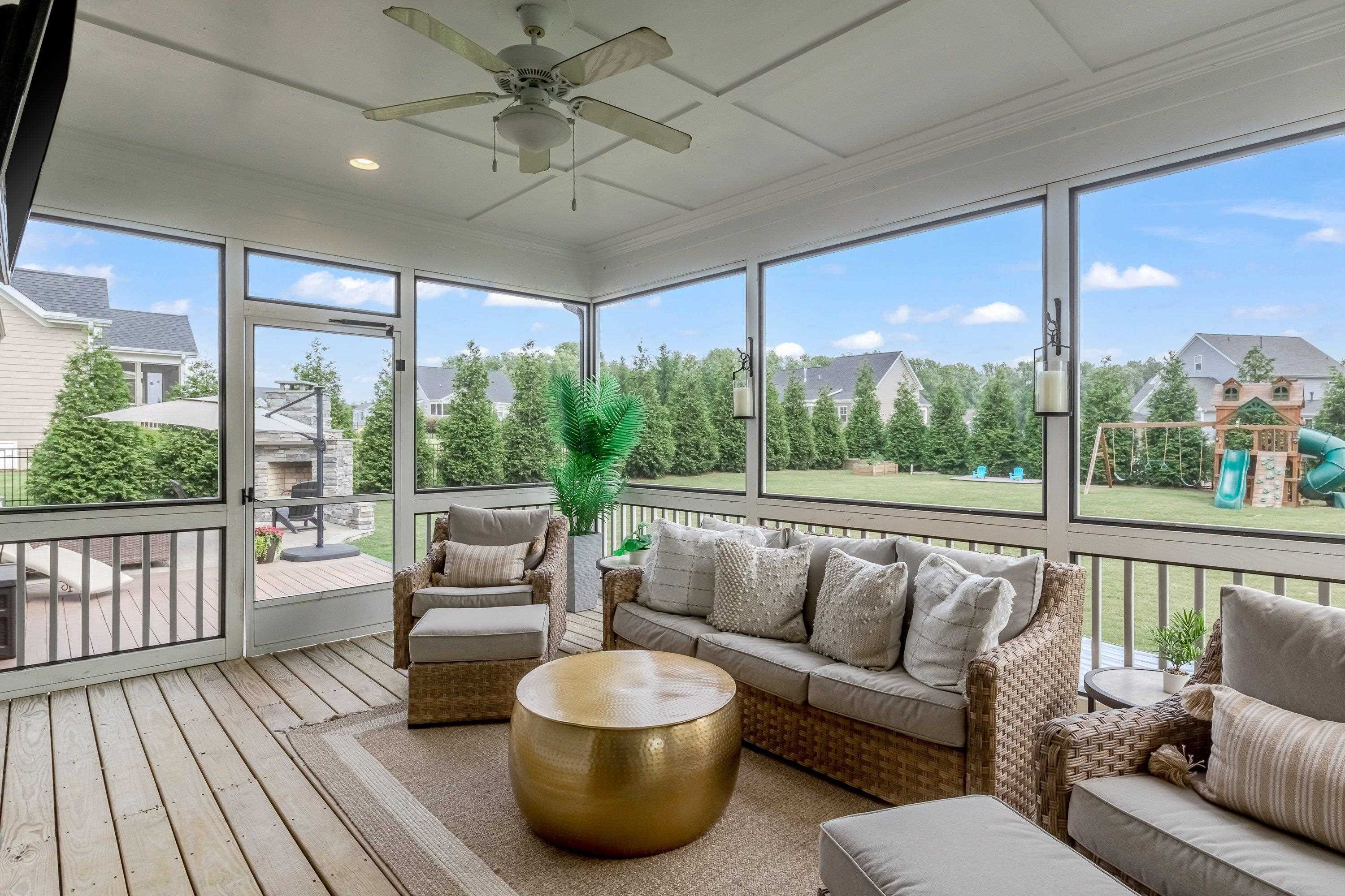 4136 Olde Judd Drive Willow Spring, NC 27592 - Photo 36 of 47 a living room with furniture and a floor to ceiling window