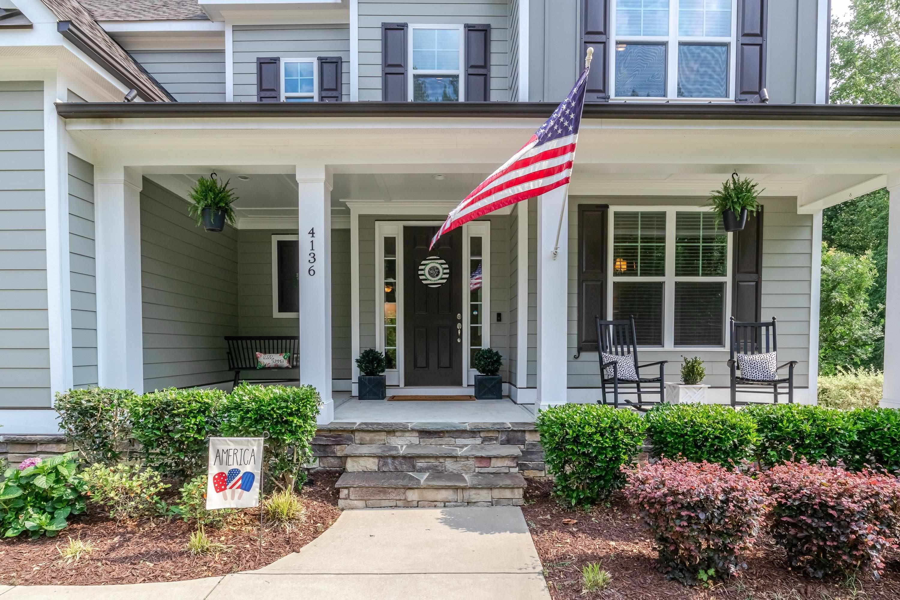4136 Olde Judd Drive Willow Spring, NC 27592 - Photo 4 of 47 a front view of a building with garden