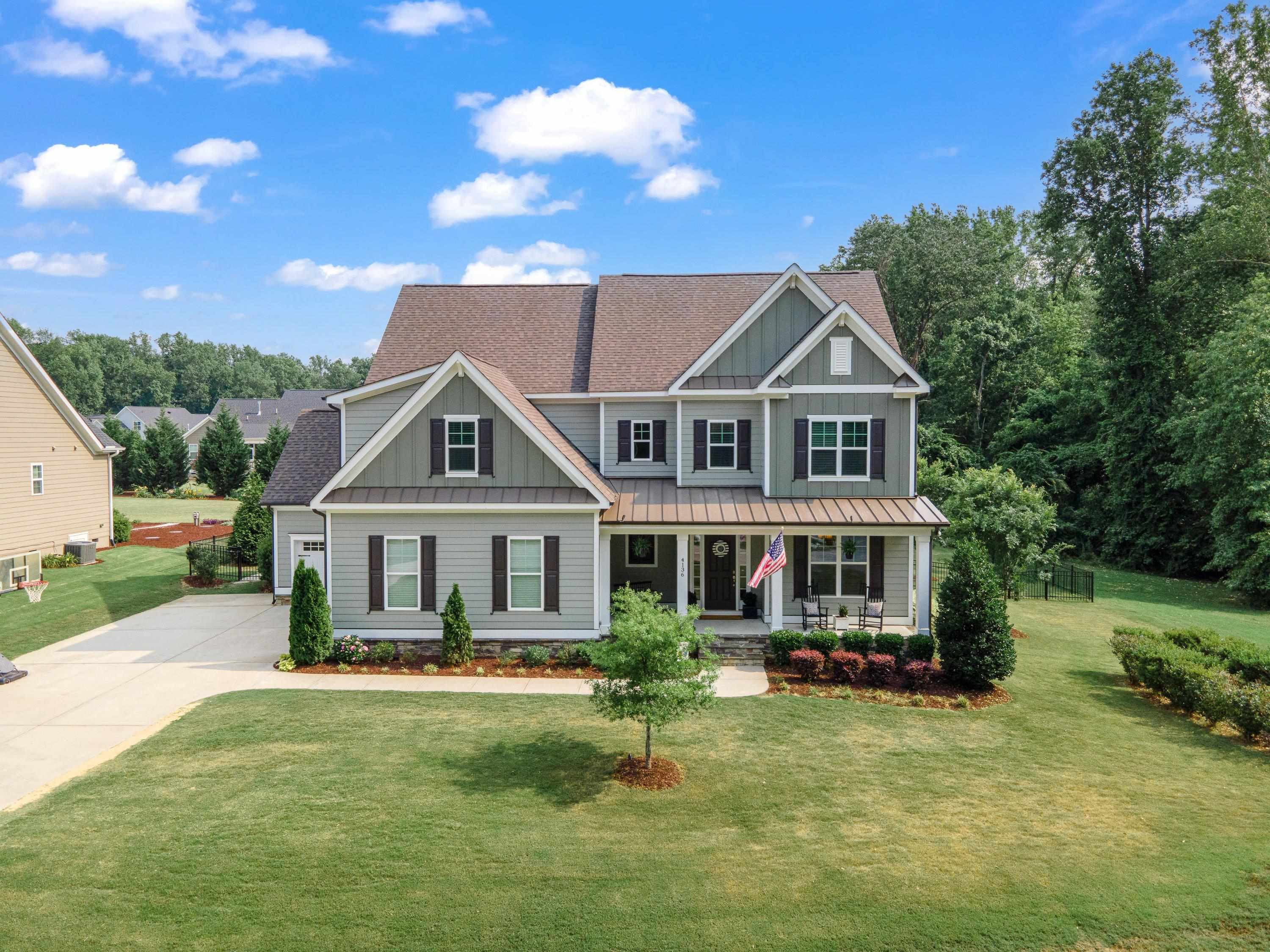 4136 Olde Judd Drive Willow Spring, NC 27592 - Photo 45 of 47 a front view of a house with a yard table and chairs